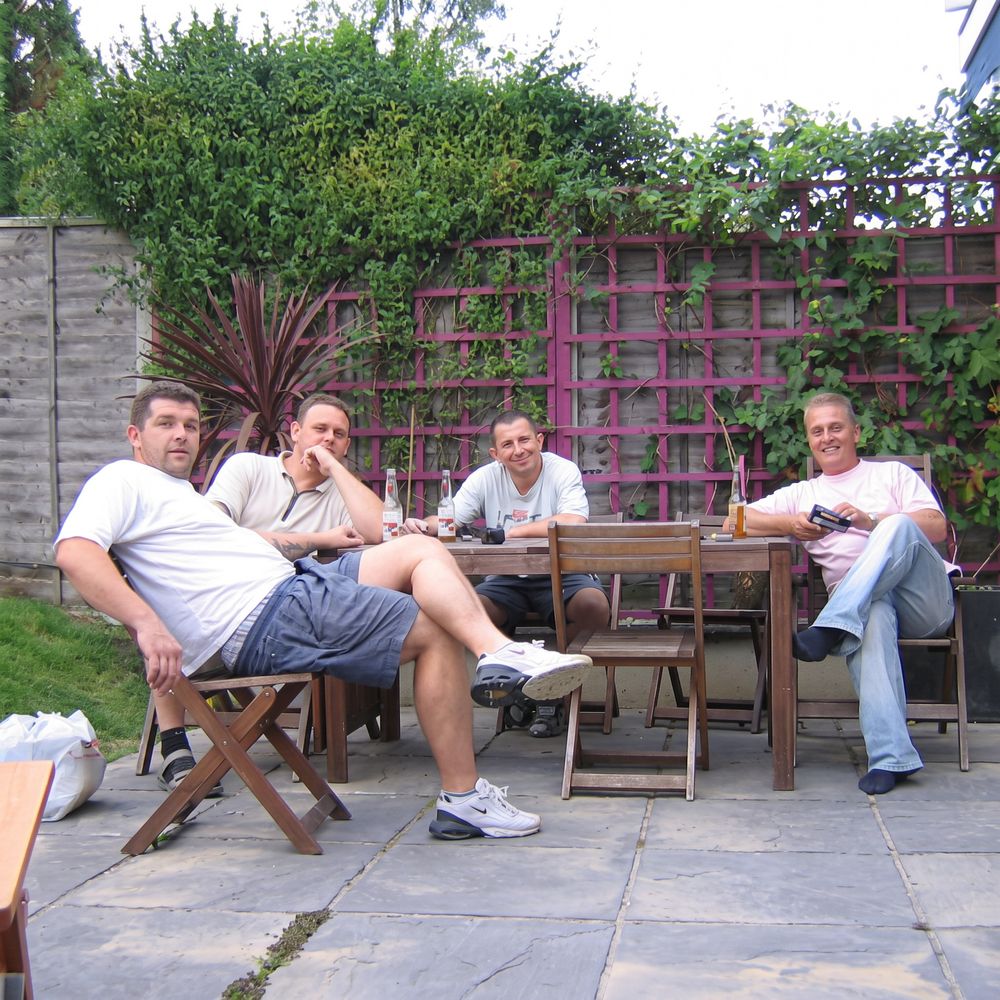 Gavin Giddings (right) with his long-standing team during his years as a contractor